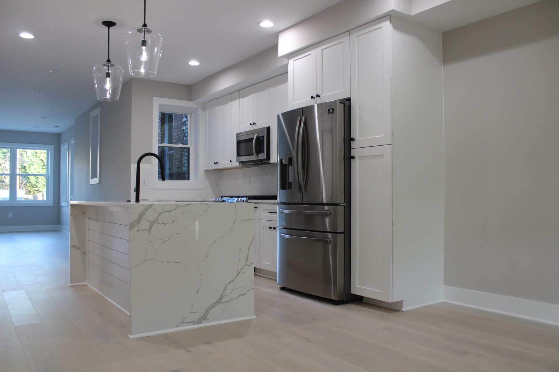 Calacatta Laza With White Shaker Cabinets - Erva Stone & Design